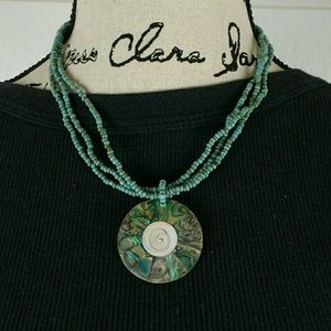 Turquoise-colored beaded necklace shell pendant